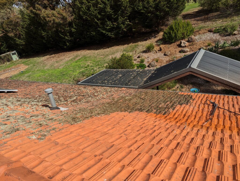 A Terracotta Roof In The Process Being Cleaned By True Roof